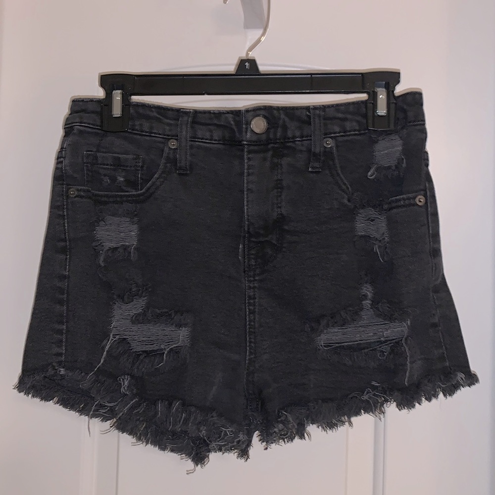 Black distressed jean shorts. Frayed edges